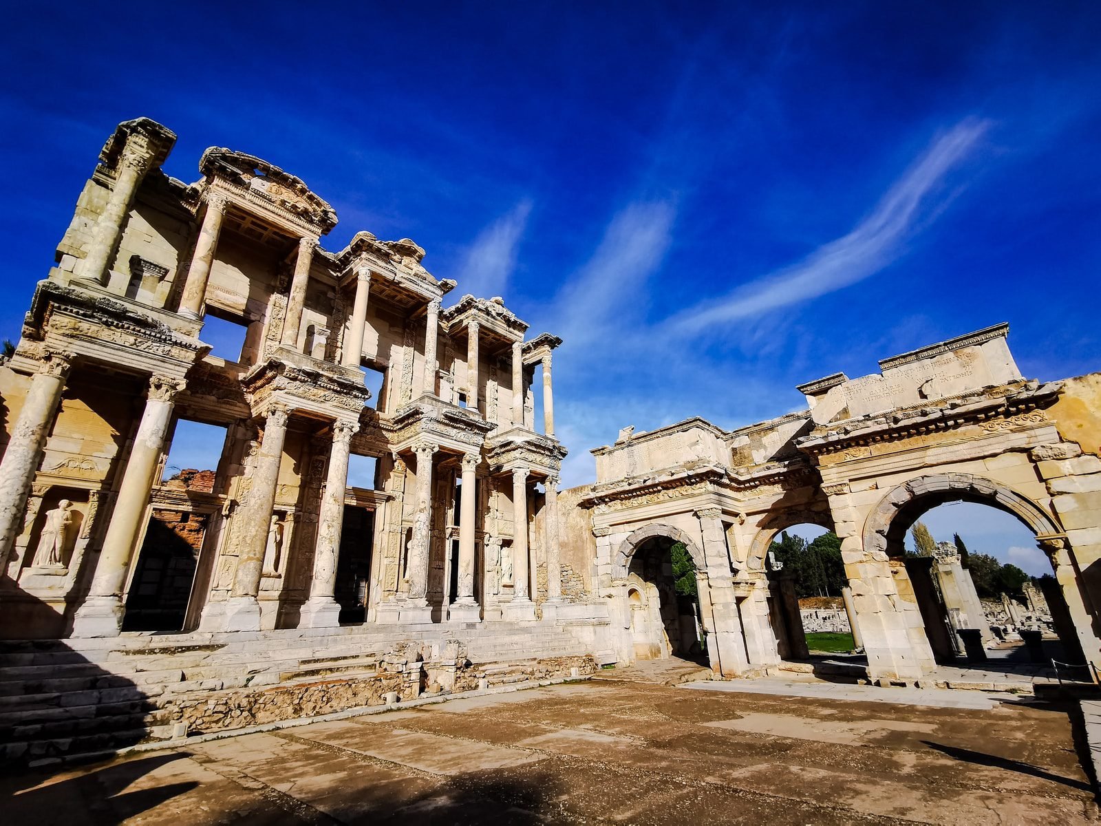 Ephesus - brown concrete building under blue sky during daytime